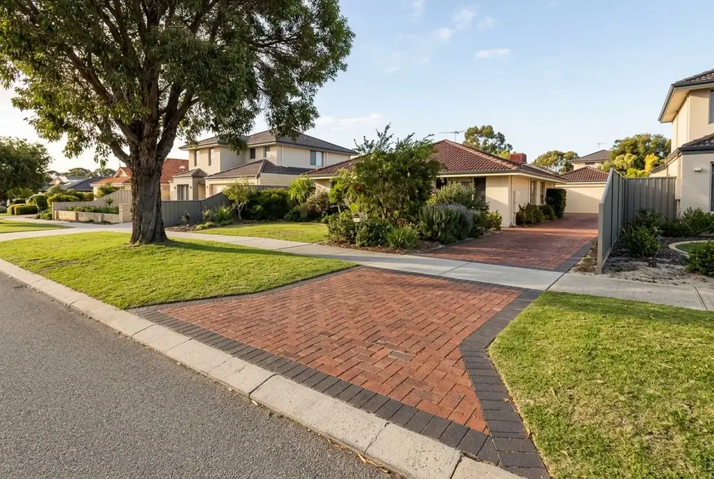 Brick paved crossover in red clay herringbone with a continuous footpath in Perth by IBP Paving