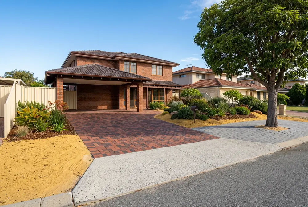 Relaid paver driveway with a concrete crossover apron at an established home in Booragoon, Perth