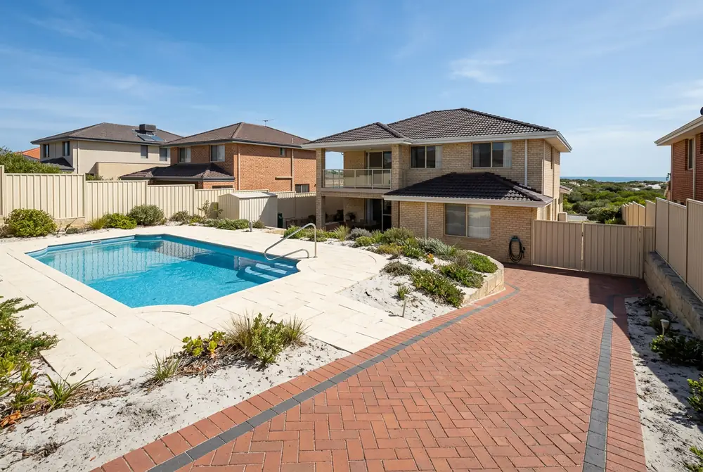 Limestone pool paving at a 1990s coastal home in Burns Beach, Perth