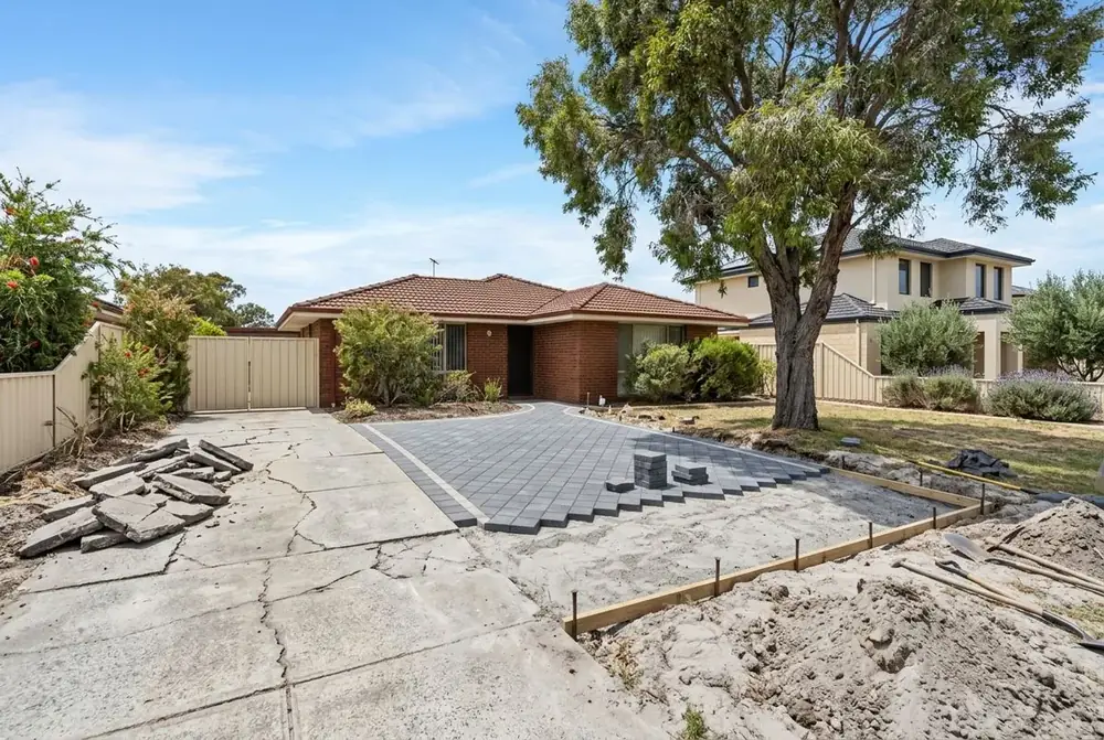 Driveway replacement beside a street tree at a 1970s home in Girrawheen, Perth by IBP Paving