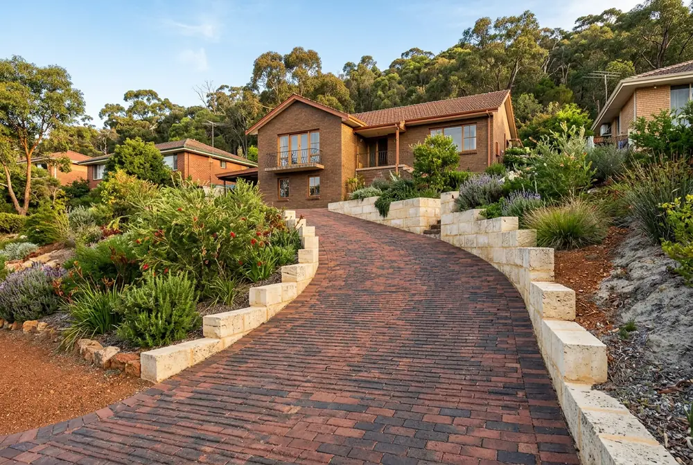 Steep paver driveway and retaining on a hillside lot in Gooseberry Hill, Perth