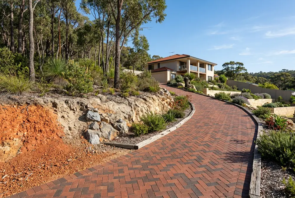 Sloping herringbone brick driveway on laterite and rock in Greenmount, Perth