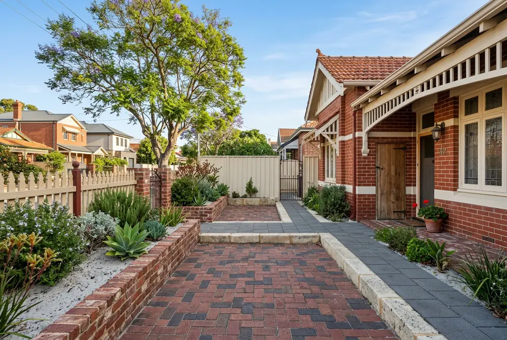 Narrow brick paved side path and courtyard at a character home in Highgate, Perth