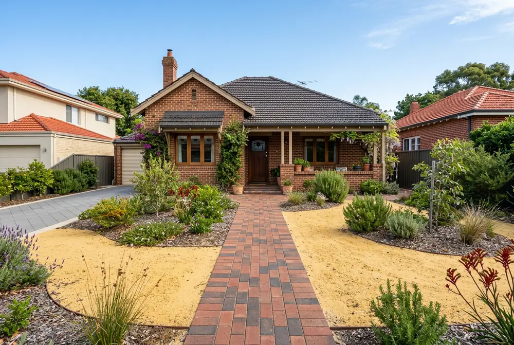 Level clay paver path to a character home in Menora, Perth