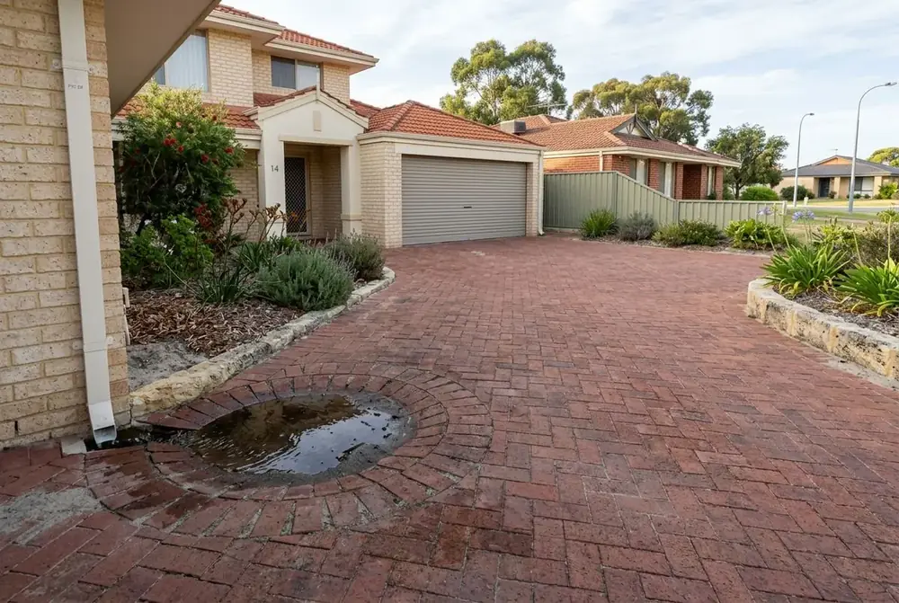 Sunken brick paving beside a downpipe in Alexander Heights, Perth by IBP Paving