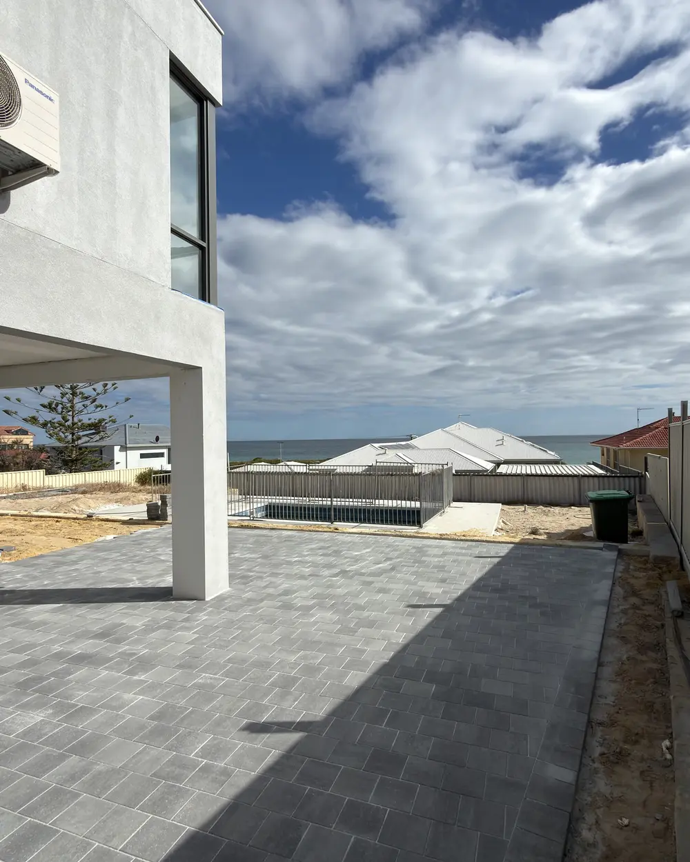 Charcoal paved side driveway on a modern Perth home by IBP Paving