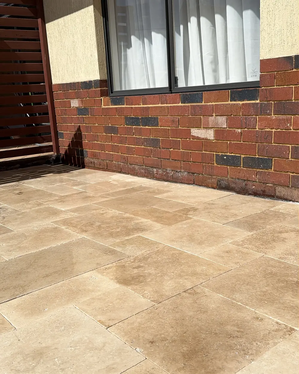 Travertine paving at a front entry in Perth by IBP Paving